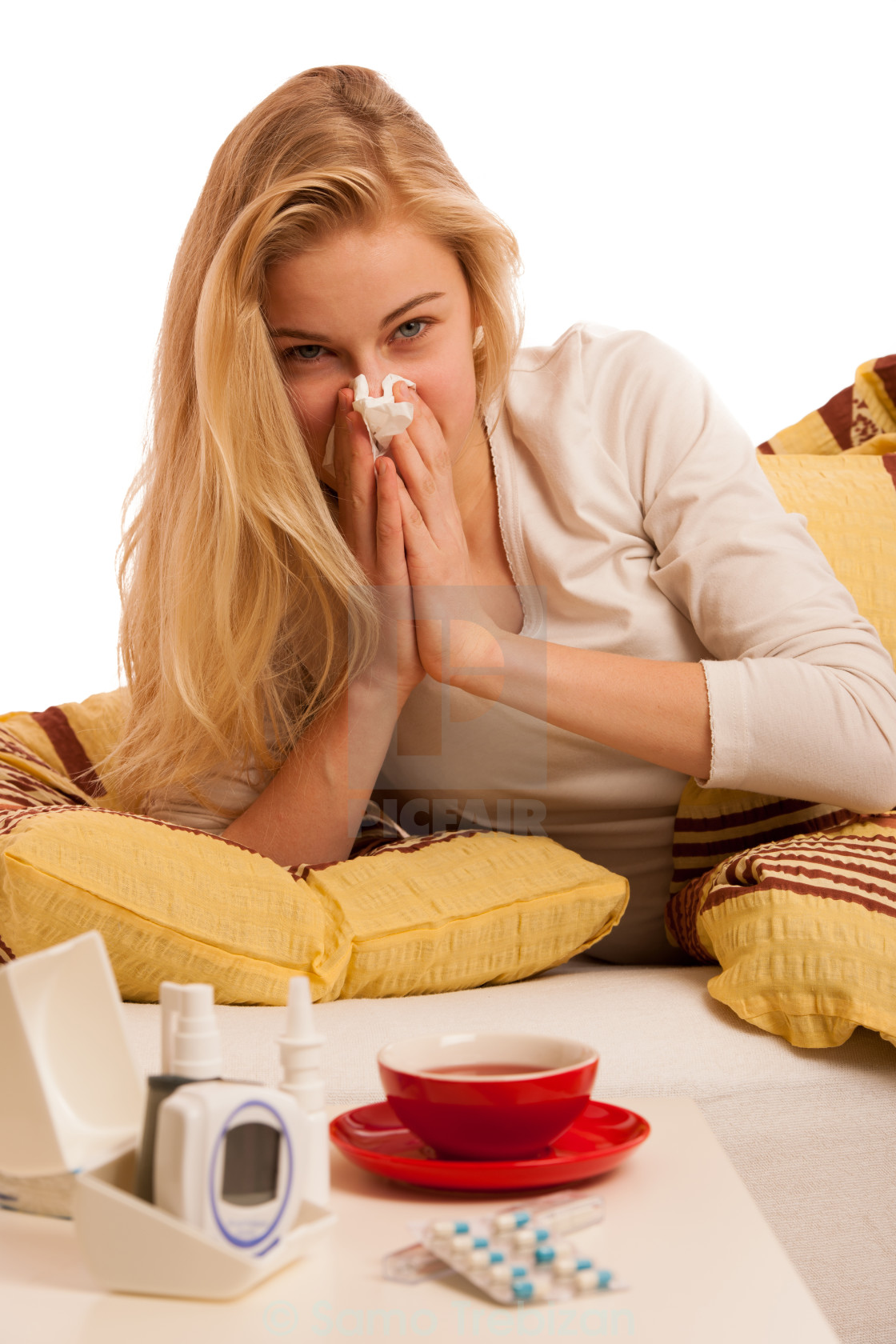 Sick woman lying in bed covered with blanket, feeling ill, has flu and